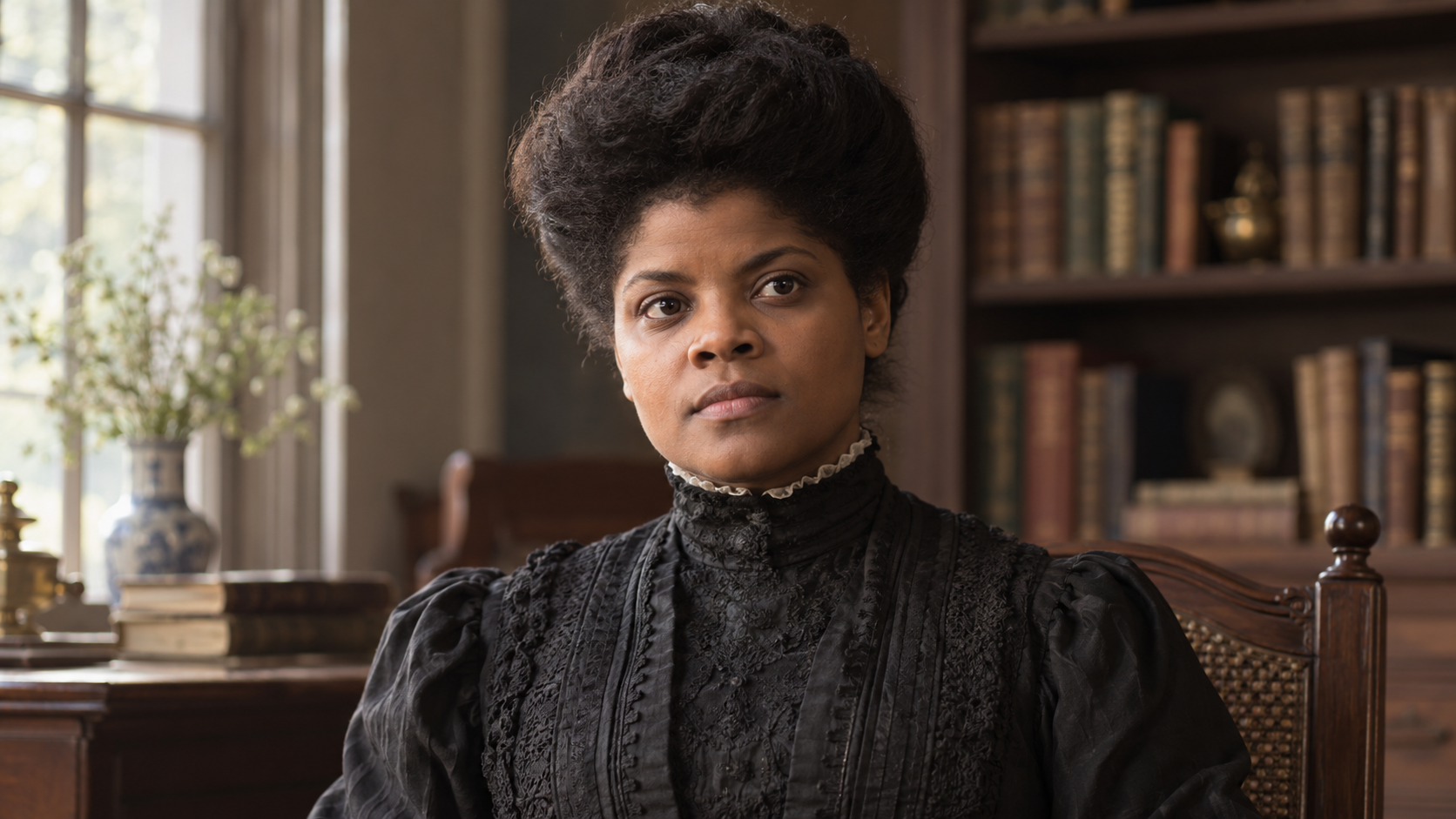 Realistic editorial recreation of Ida B. Wells in a period-appropriate study.