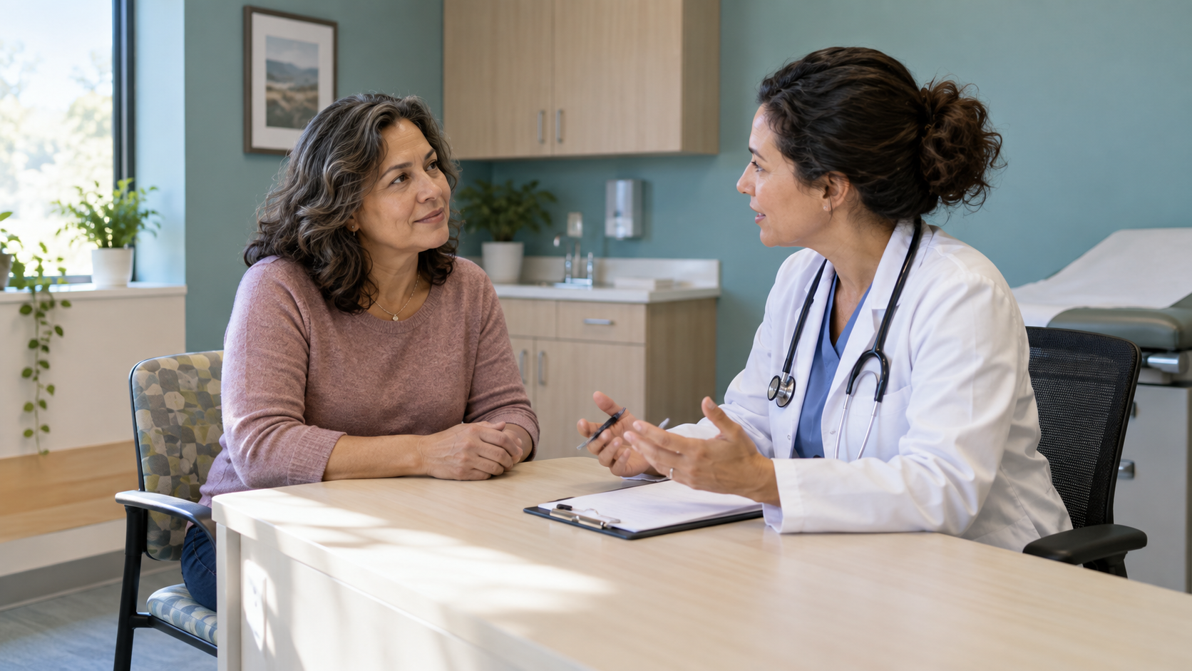 A woman discusses preventive screening with a physician across a desk in an examination room.