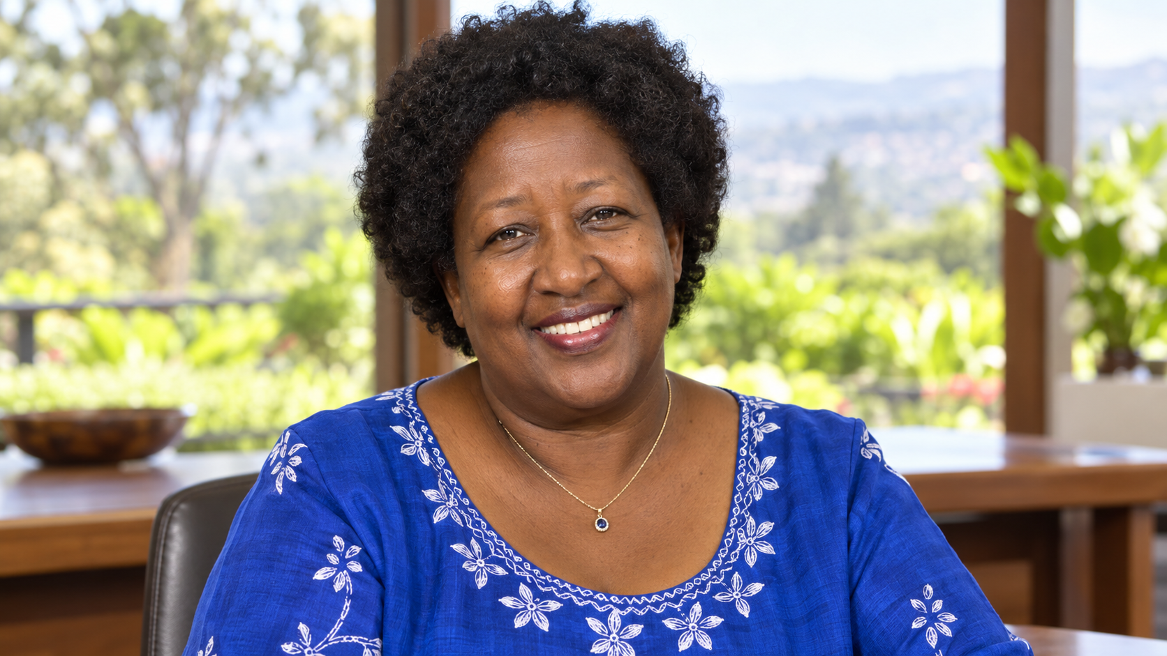 AI-created realistic portrait of Agnes Binagwaho in a global health university seminar room.