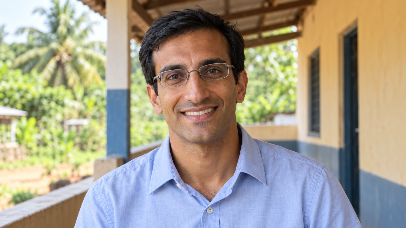 AI-created realistic portrait of Raj Panjabi in a rural health clinic veranda.