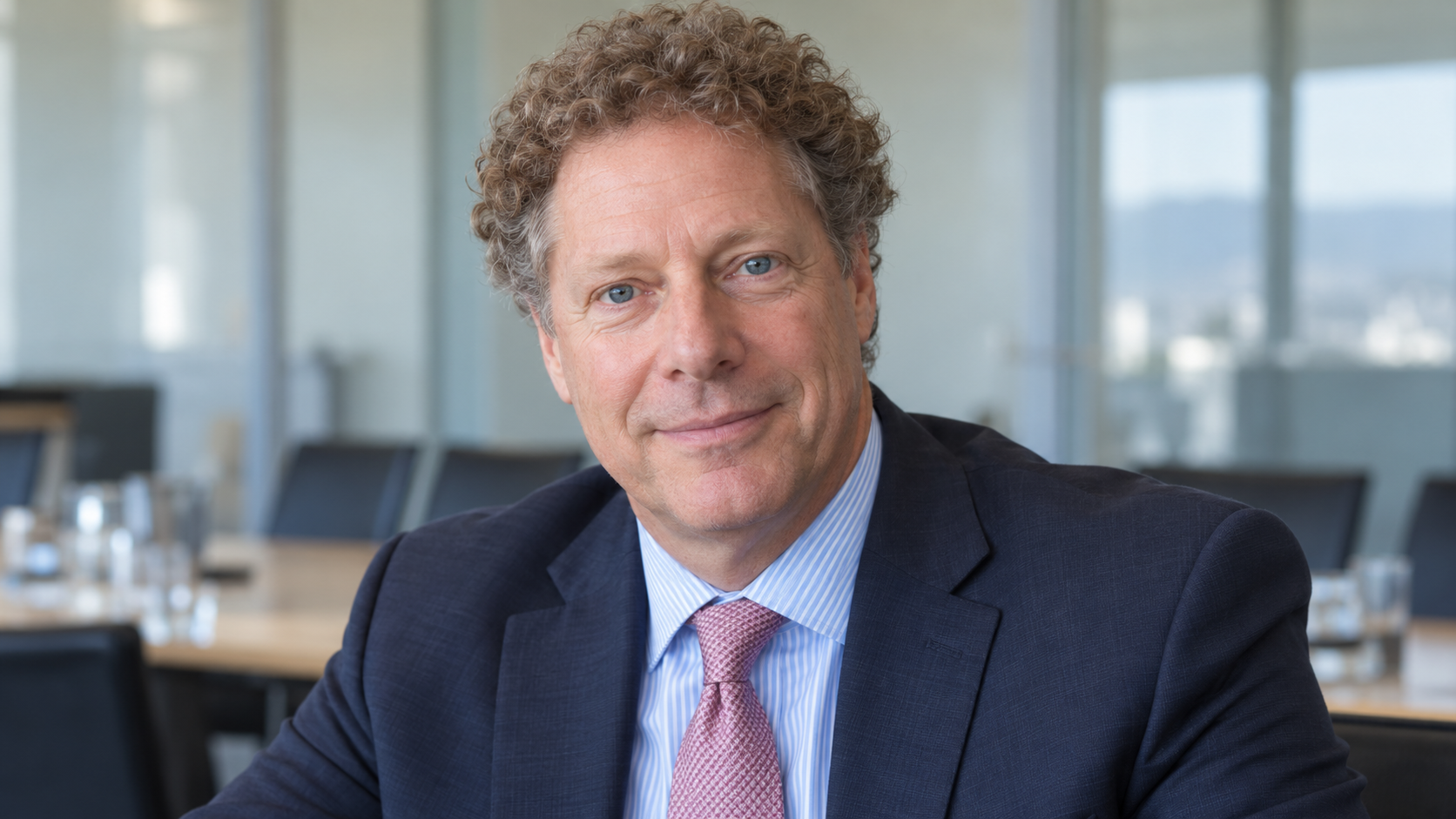 AI-created realistic portrait of Seth Berkley in a conference meeting room.