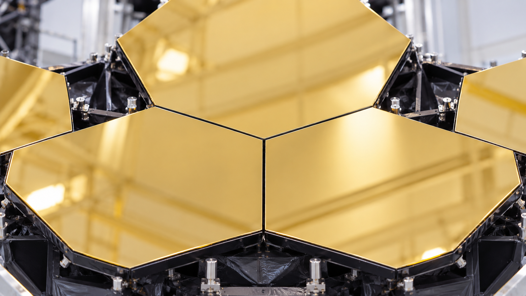 AI-generated historical reconstruction of Webb’s gold-coated hexagonal mirror segments during prelaunch assembly.