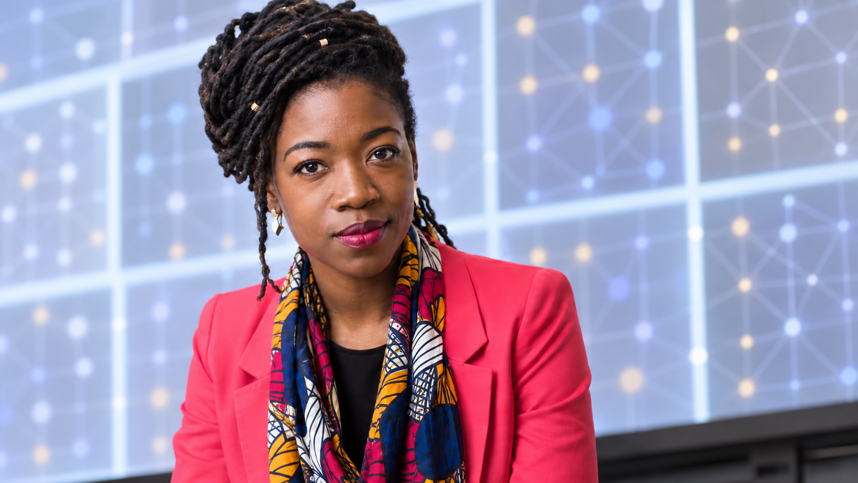 Editorial portrait of Joy Buolamwini with abstract facial-analysis geometry and no captured faces
