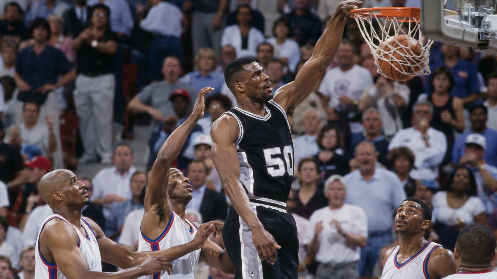 Photorealistic historical reconstruction of David Robinson scoring during his 71-point game in 1994.