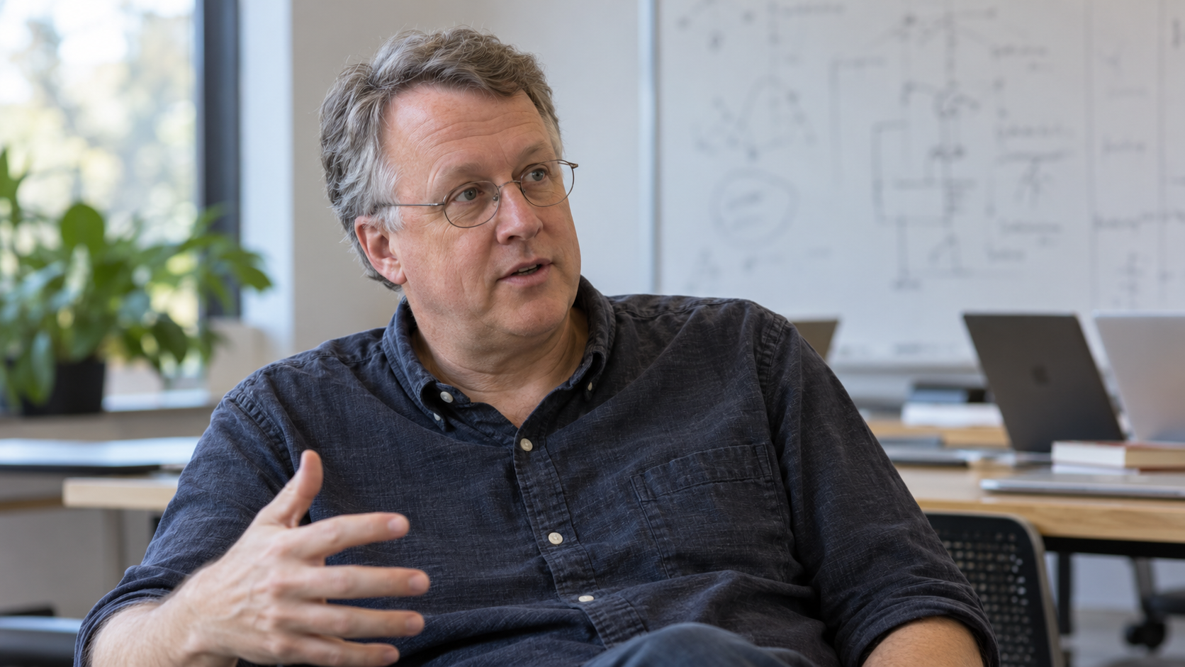 AI-generated editorial portrait of Paul Graham mentoring founders at a whiteboard
