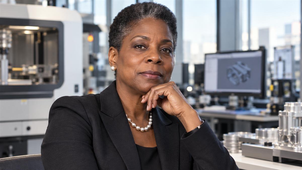 AI-generated editorial portrait of Ursula Burns in an engineering and executive leadership environment