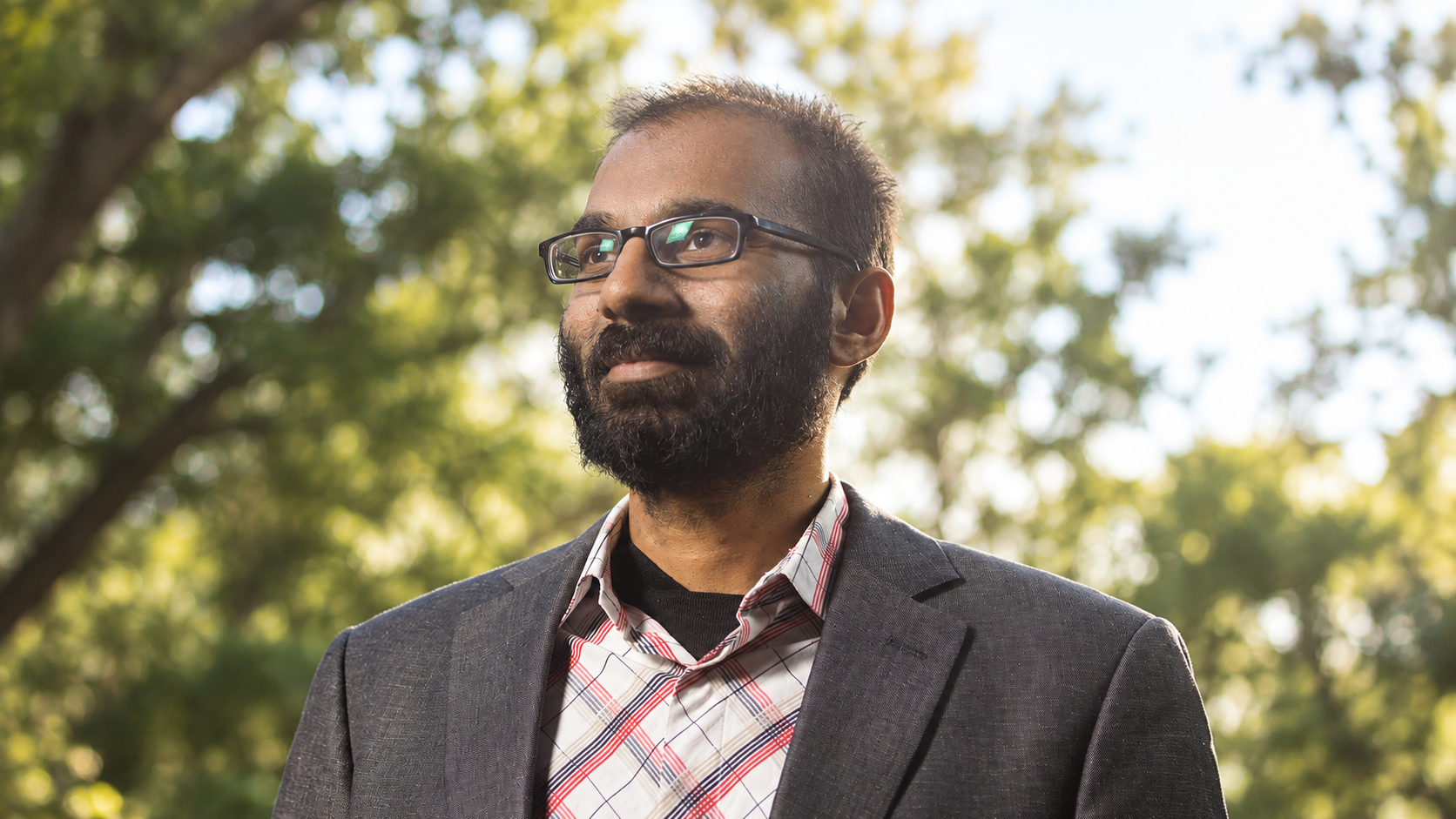 AI-generated realistic portrait of Paul Kalanithi in a quiet outdoor portrait setting.