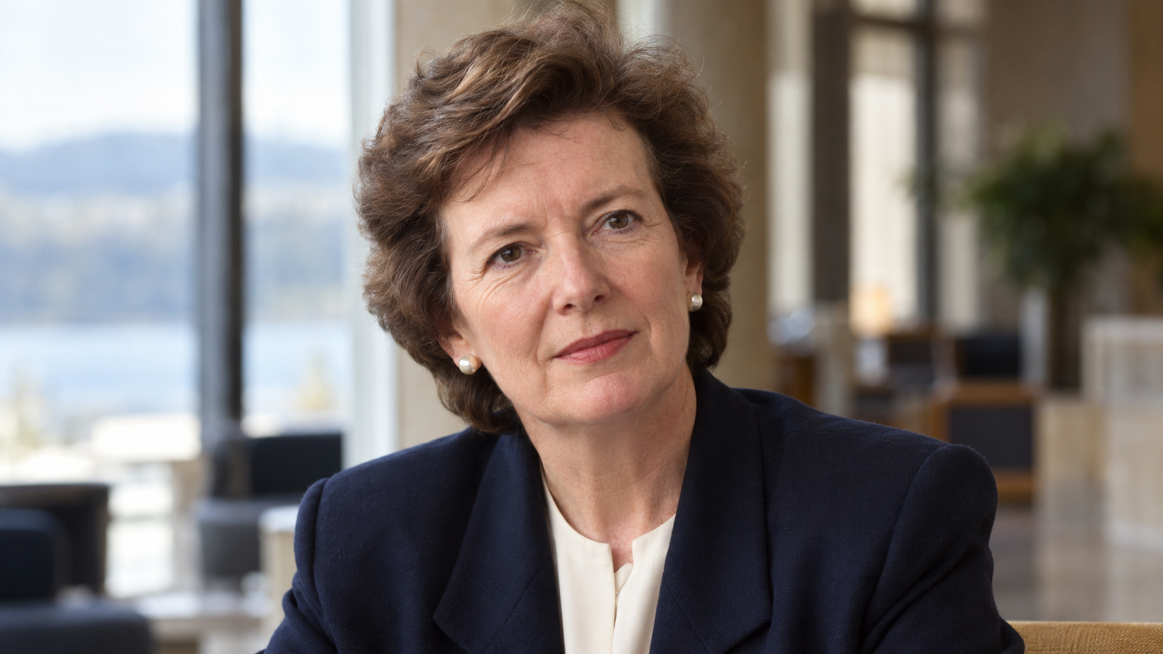 Realistic editorial recreation of Mary Robinson in a Geneva conference-room foyer around 1998.