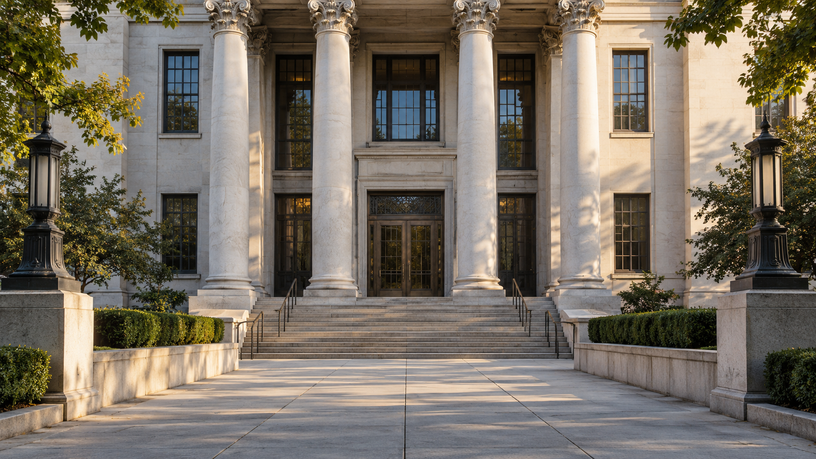 A quiet courthouse entrance with a path leading to closed doors