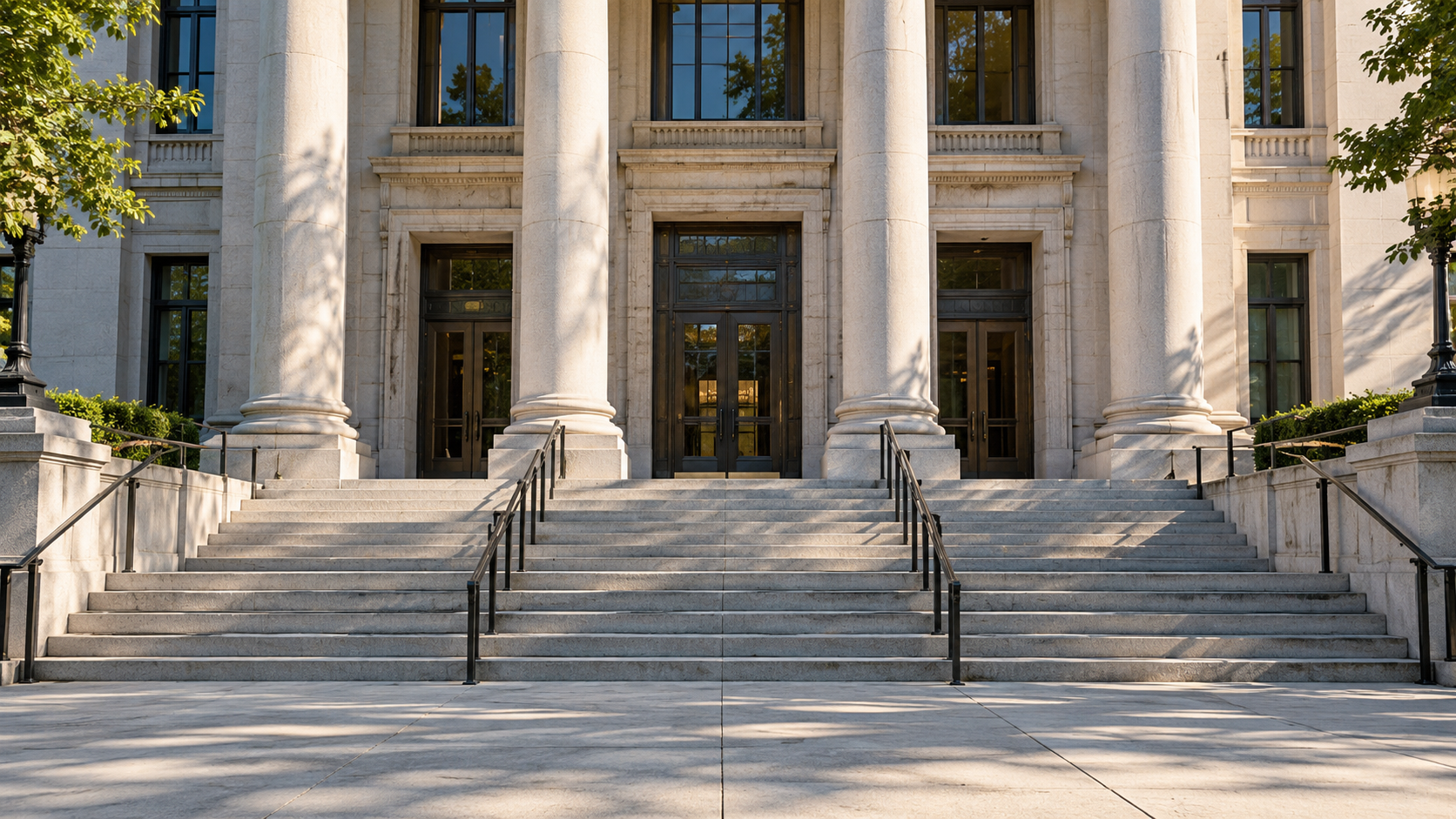 A state courthouse facade with a broad public entrance in afternoon light