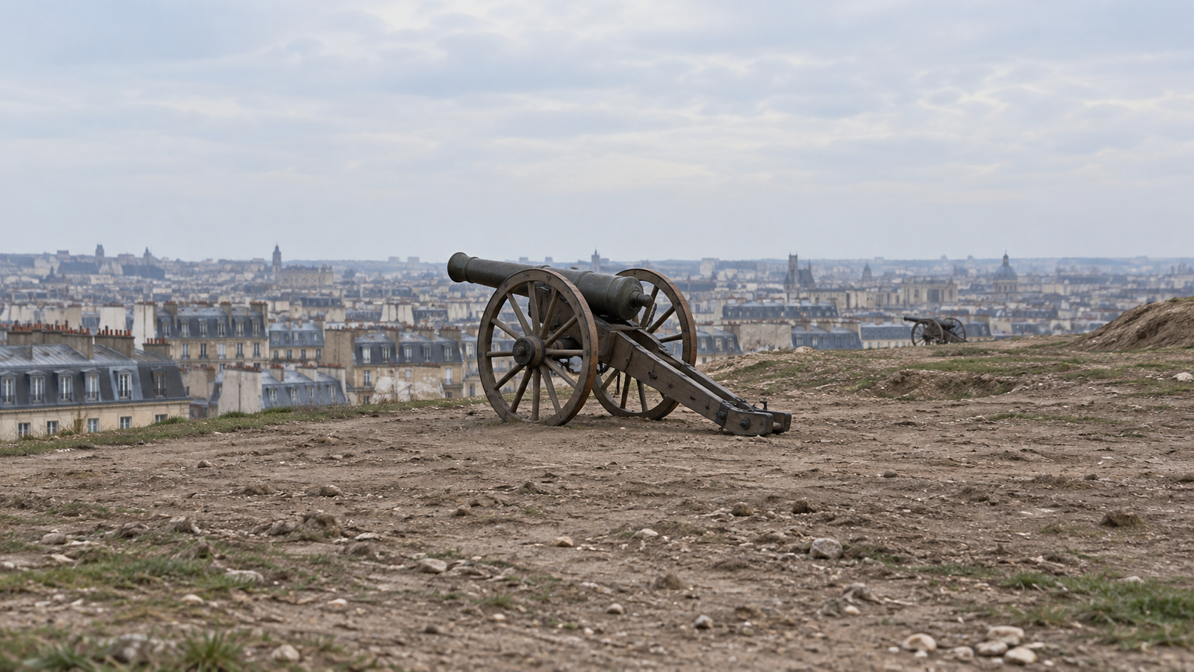 Historical reconstruction of a nineteenth-century cannon on the bare heights of Montmartre overlooking Paris in 1871.