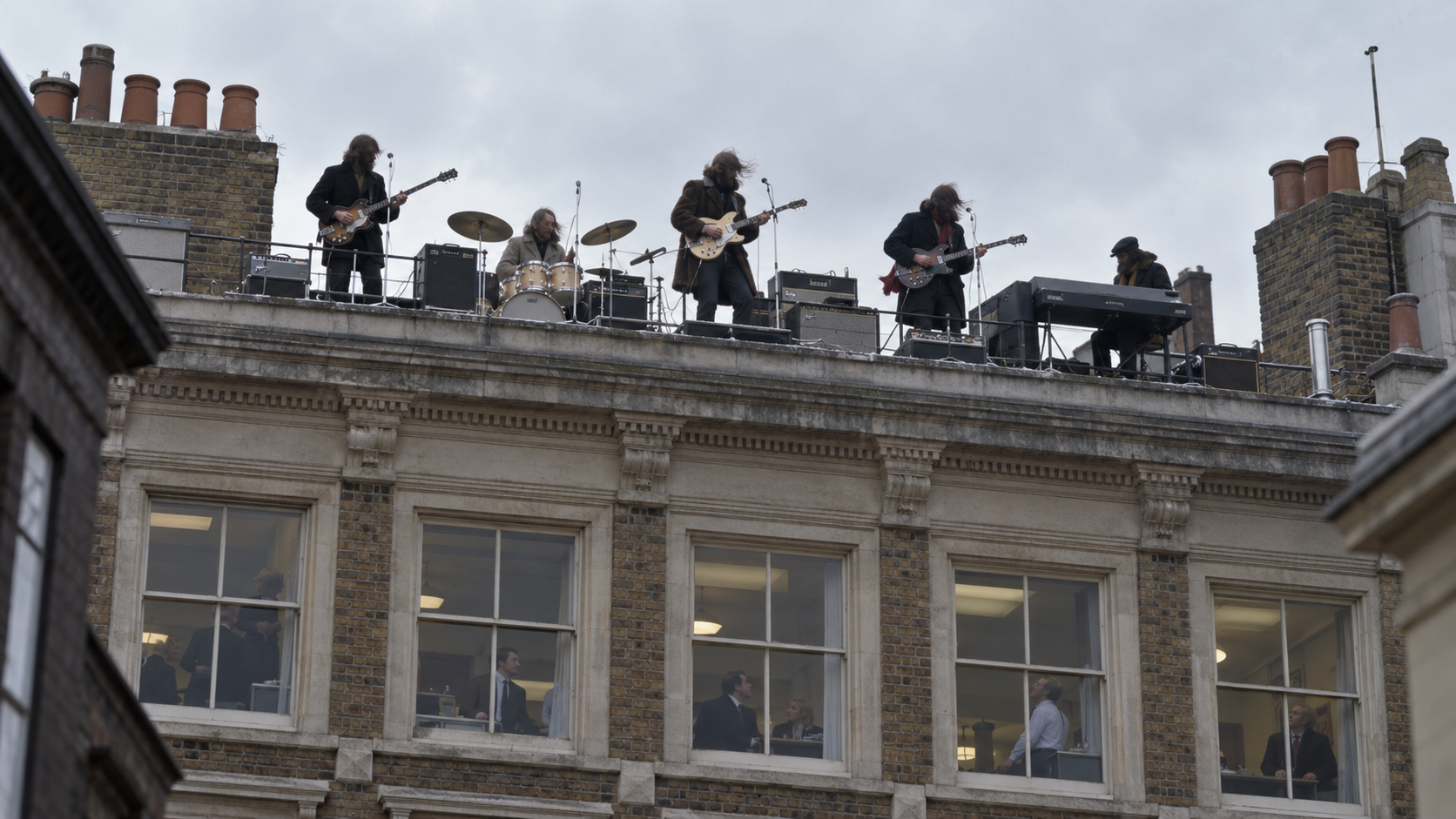 AI reconstruction of a rock band performing on a cold London rooftop in 1969
