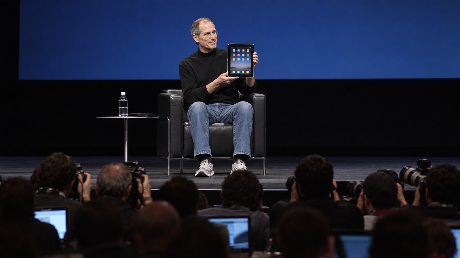 AI reconstruction of a 2010 San Francisco stage presentation introducing a thin touchscreen tablet computer.